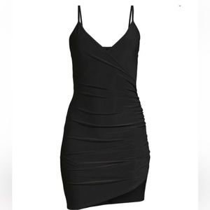 BEBE NWT Black Mini Dress. Low V Neckline. Asymmetrical Ruched. Size Large